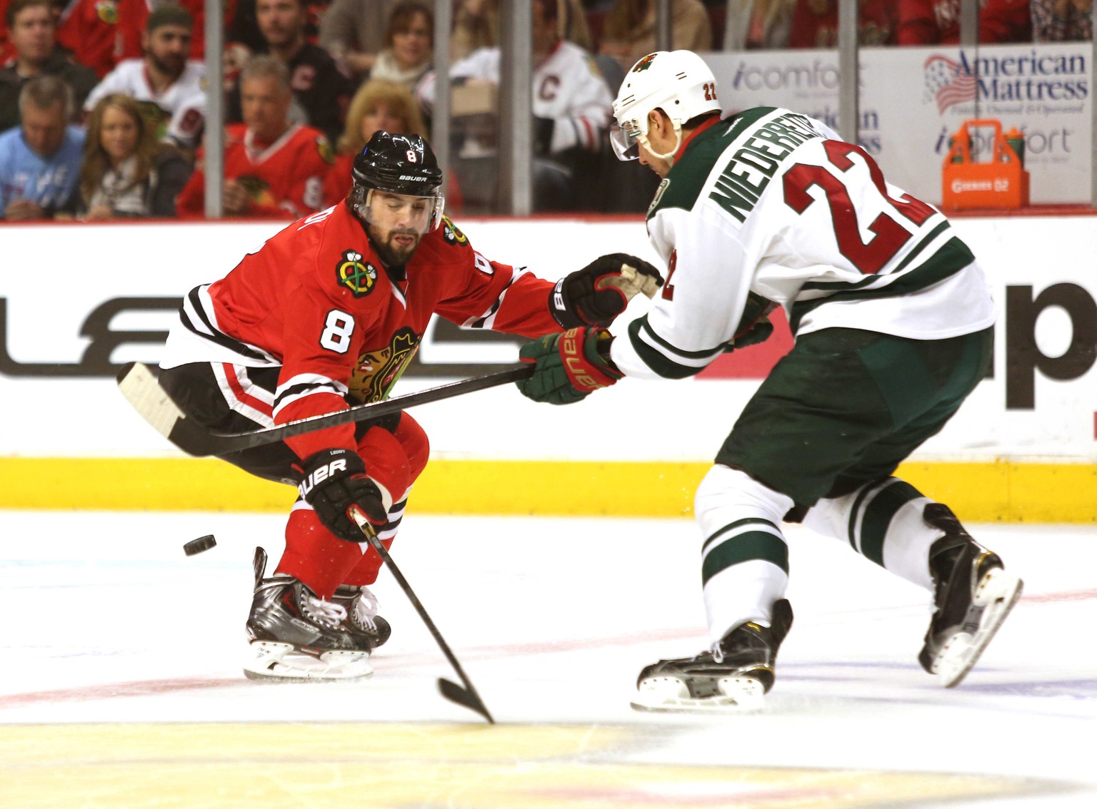 Chicago Blackhawk defenseman Nick Leddy pressures the Wild&#039;s Nino Niederreiter, right, during Game 1 of an NHL hockey second-round playoff series in Chicago, Friday, May 2, 2014. The Blackhawks w ...
