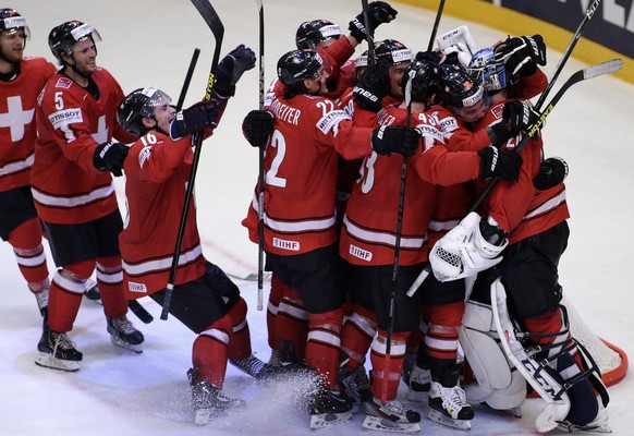 Switzerland&#039;s players celebrate their victory over USA, during the IIHF Ice Hockey World Championships semifinal match Switzerland vs USA at the Globe Arena in Stockholm, Sweden, on Saturday, 18  ...