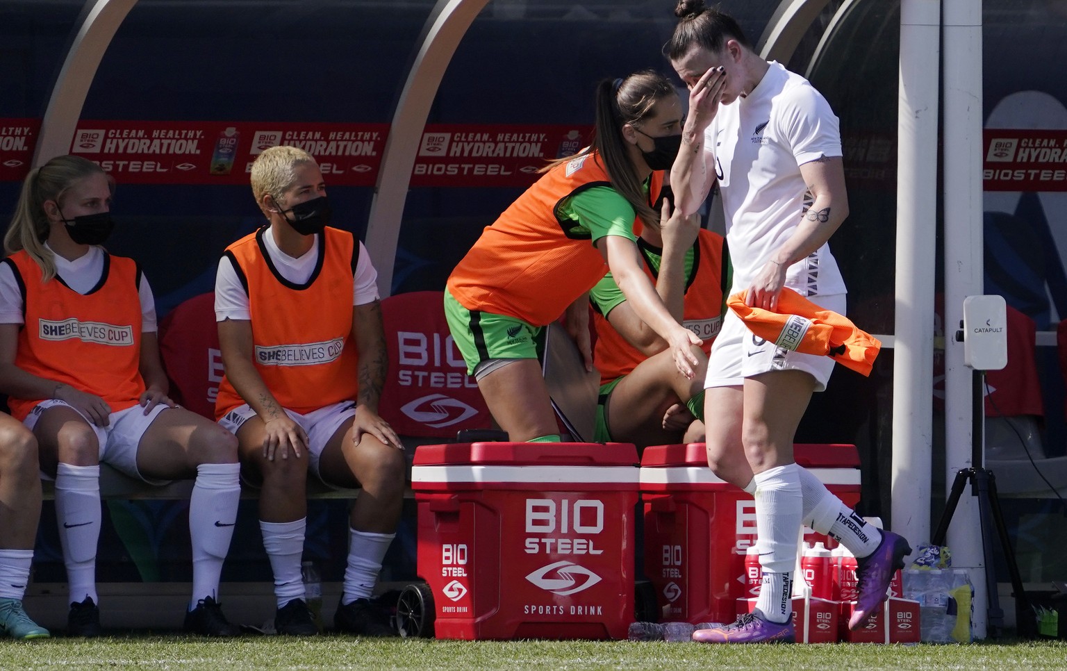 New Zealand defender Meikayla Moore wipes her face as she walks to the bench after being taken out of the game during the first half of the 2022 SheBelieves Cup soccer match against the United States  ...