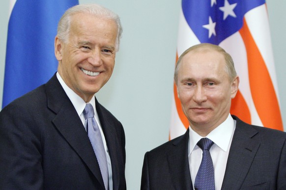 FILE - In this March 10, 2011 file photo, then Vice President Joe Biden, left, shakes hands with Russian Prime Minister Vladimir Putin in Moscow, Russia. President Joe Biden will hold a summit with Vl ...