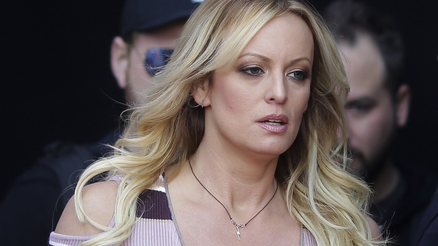 FILE - In this Thursday, Oct. 11, 2018, file photo, adult film actress Stormy Daniels arrives for the opening of the adult entertainment fair &quot;Venus,&quot; in Berlin. On Monday, Oct. 15, 2018, a  ...