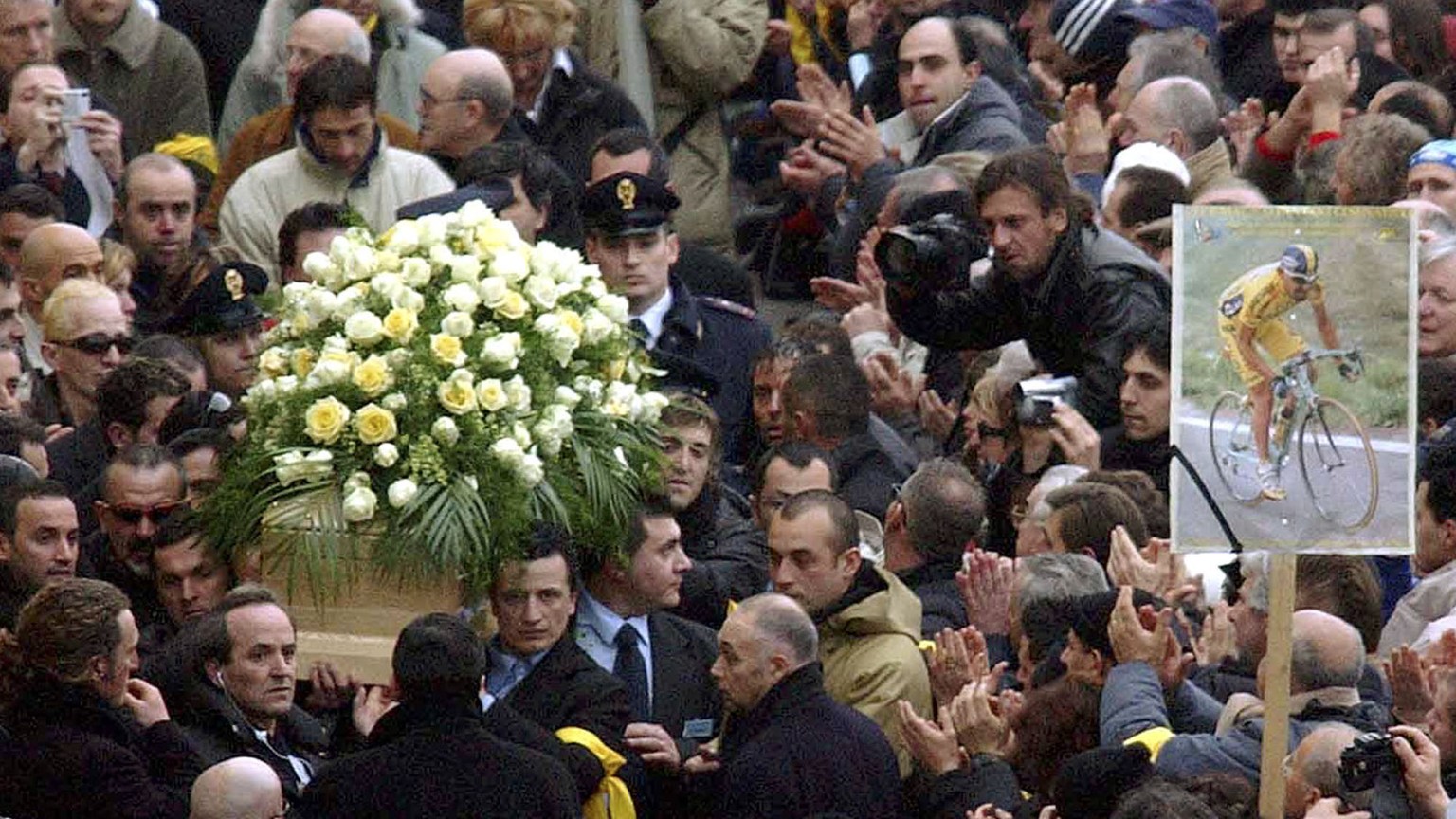 The coffin of Italian cycling legend and former Tour de France and Giro d'Italia race winner Marco Pantani is carried outside the San Giacomo church in Cesenatico, northern Italy, Wednesday, Feb. 18,  ...