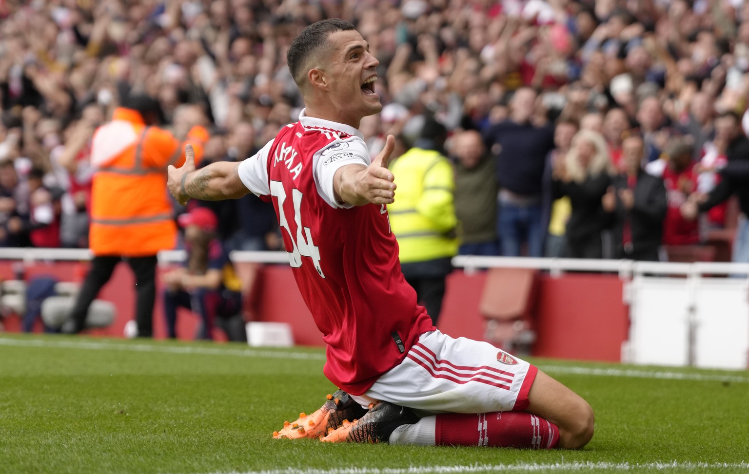 Arsenal&#039;s Granit Xhaka celebrates after scoring his side&#039;s third goal during the English Premier League soccer match between Arsenal and Tottenham Hotspur, at Emirates Stadium, in London, En ...