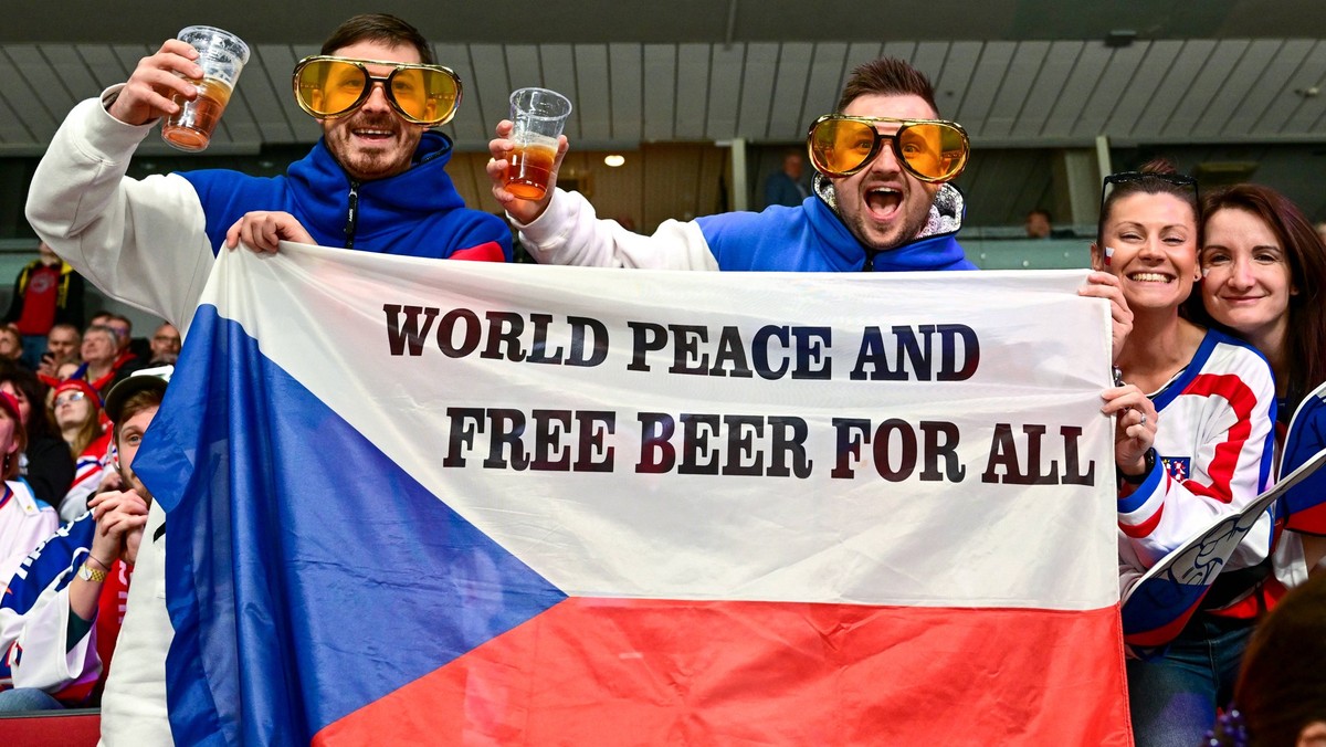 Czech fans holding flag with writing WORLD PEACE AND FREE BEER FOR ALL during the IIHF Ice hockey, Eishockey World Championship, WM, Weltmeisterschaft Group B match Czech Republic vs Slovenia in Riga, ...