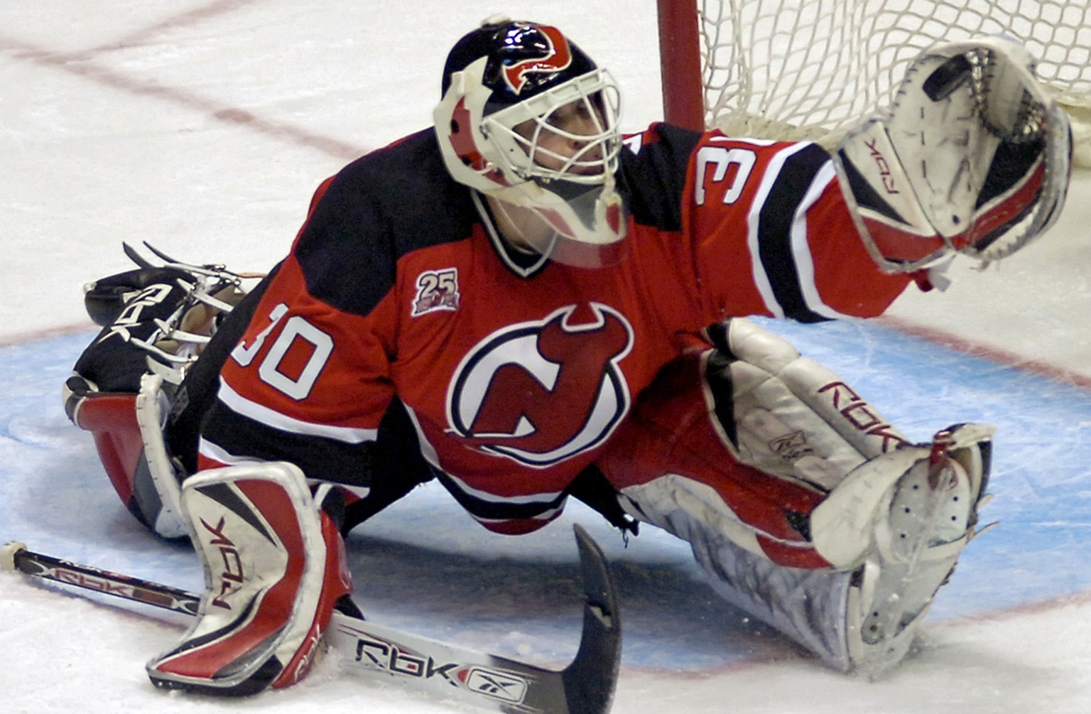 New Jersey Devils goaltender Martin Brodeur gloves the puck during third period NHL hockey against the Pittsburgh Penguins Tuesday, Dec. 26, 2006 in East Rutherford, N.J. Brodeur shutout the Penguins ...