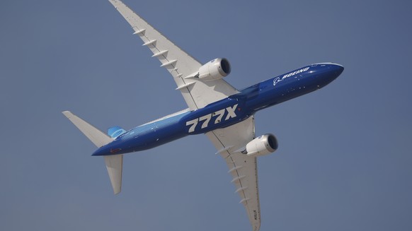 A Boeing 777X performs during the opening day of the Dubai Air Show, United Arab Emirates, Monday, Nov. 13, 2023. (AP Photo/Kamran Jebreili)