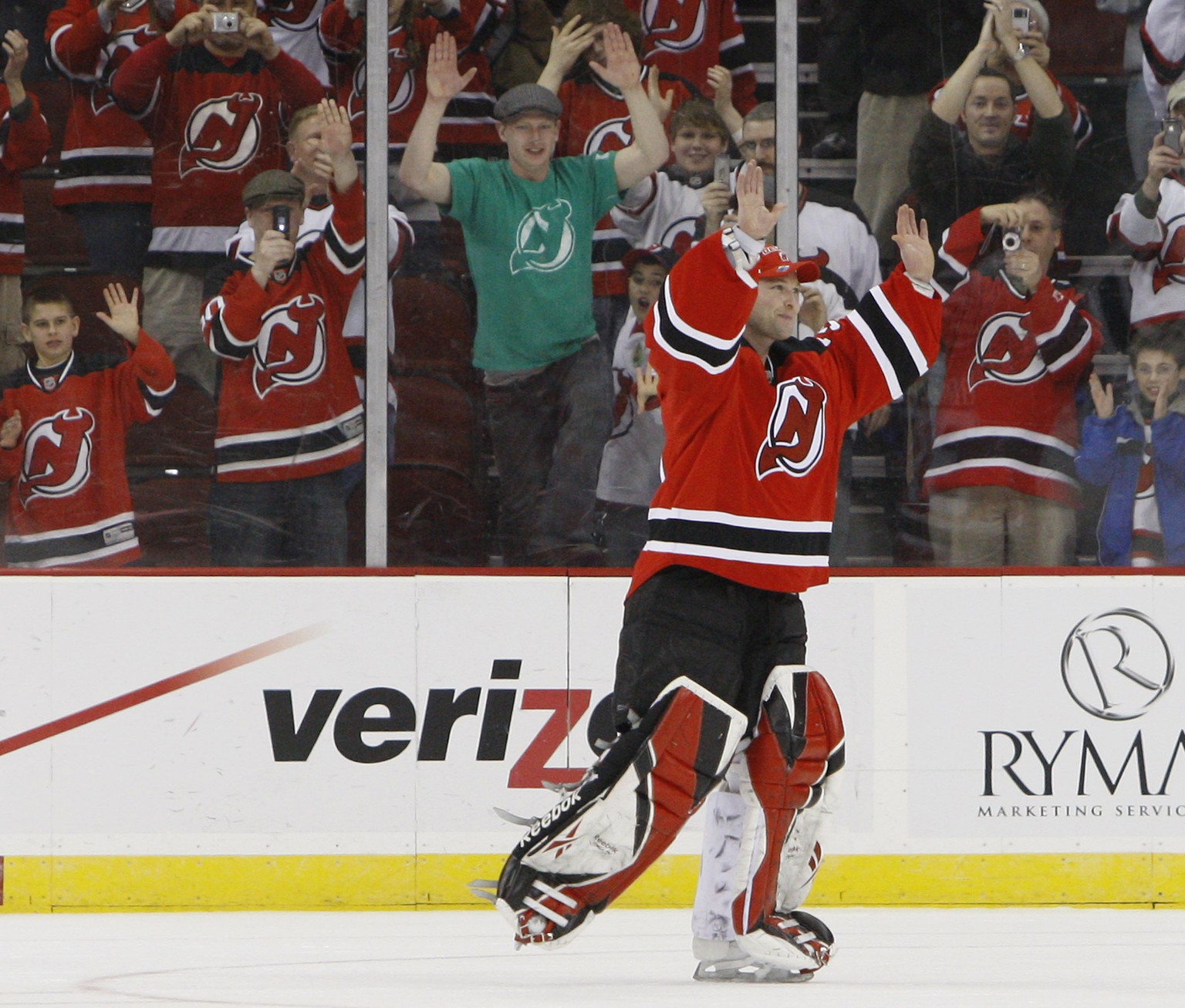 FILE - In this March 17, 2009, file photo, New Jersey Devils goalie Martin Brodeur skates around the ice to acknowledge cheers from fans after recording his record-breaking 552nd career win in the Dev ...