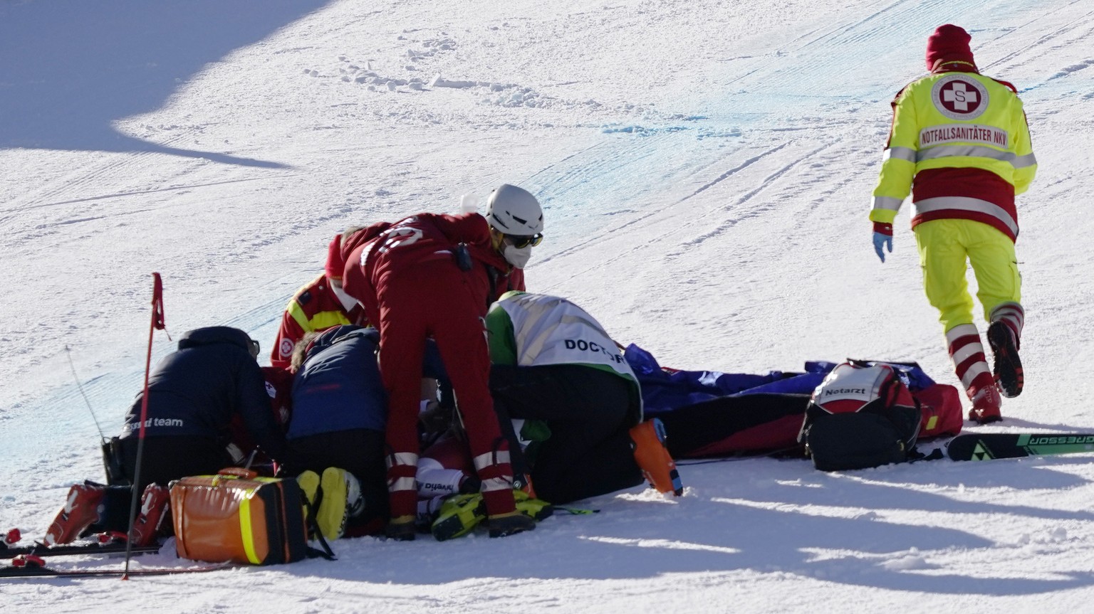 Switzerland&#039;s Urs Kryenbuehl receives medical help after a bad crash at finish line during an alpine ski, men&#039;s World Cup downhill in Kitzb