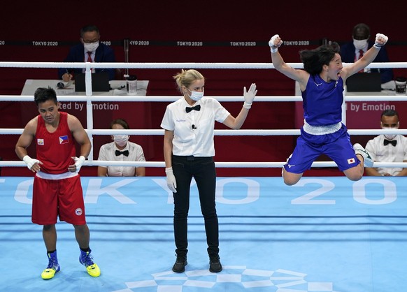 Japan&#039;s Sena Irie, right, celebrates defeating Philippines&#039;s Nesthy Petecio, left, to win the women&#039;s featherweight 60-kg final boxing match at the 2020 Summer Olympics, Tuesday, Aug. 3 ...