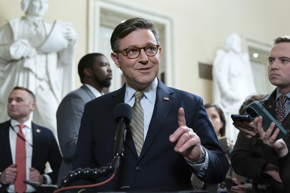 Speaker of the House Mike Johnson, R-La., talks to reporters after passing the funding bill to avert the government shutdown at the Capitol in Washington, Friday, Dec. 20, 2024. (AP Photo/Jose Luis Ma ...