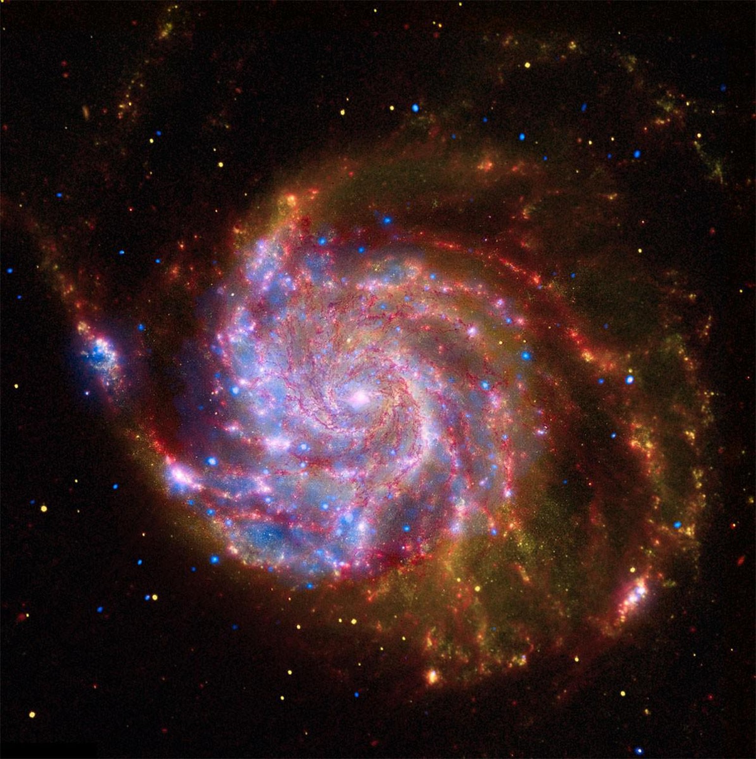 Galaxie Messier 101 (NGC 5457, Pinwheel-Galaxie oder Feuerrad-Galaxie), kombinierte Aufnahmen im Infrarot-, im Röntgen- und im sichtbaren Bereich der Weltraumteleskope Spitzer, Chandra und Hubble. 
ht ...