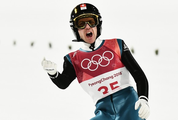 epa06511382 Simon Ammann of Switzerland reacts after his first jump of the Men&#039;s Normal Hill Individual Ski Jumping competition at the Alpensia Ski Jumping Centre during the PyeongChang 2018 Olym ...