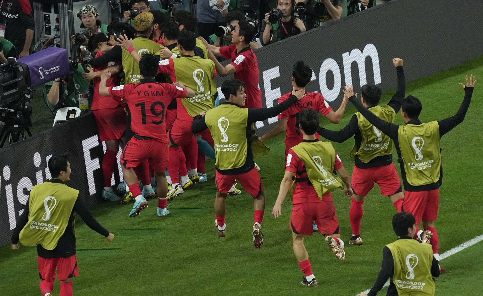 South Korea&#039;s team players celebrate after scoring their side&#039;s second goal during the World Cup group H soccer match between South Korea and Portugal, at the Education City Stadium in Al Ra ...