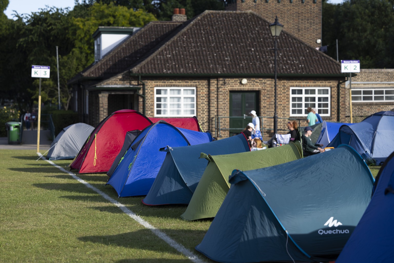 Tennis fans form the overnight tent queue to get a chance to get a ticket at the All England Lawn Tennis Championships in Wimbledon, London, Sunday, June 26, 2022. The Wimbledon Tennis Championships 2 ...