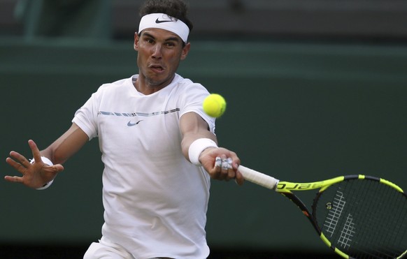 Spain&#039;s Rafael Nadal returns to Donald Young of the United States during their Men&#039;s Singles Match on day three at the Wimbledon Tennis Championships in London Wednesday, July 5, 2017. (AP P ...