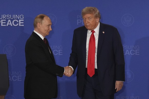President Donald Trump, right, shakes the hand of Russia&#039;s President Vladimir Putin during a joint press conference at Joint Base Elmendorf-Richardson, Alaska, Friday, Aug. 15, 2025. (AP Photo/Ja ...