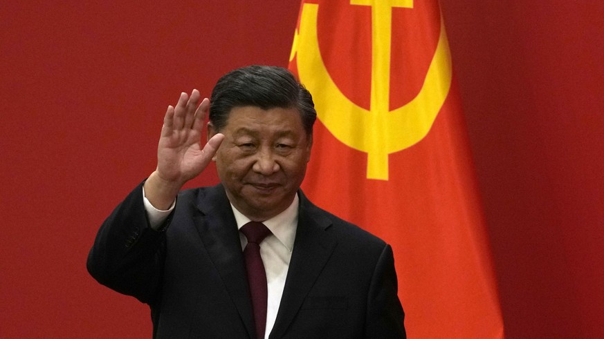Chinese President Xi Jinping waves at an event to introduce new members of the Politburo Standing Committee at the Great Hall of the People in Beijing, Sunday, Oct. 1.  23, 2022. (AP Photo/Andy Wong)
