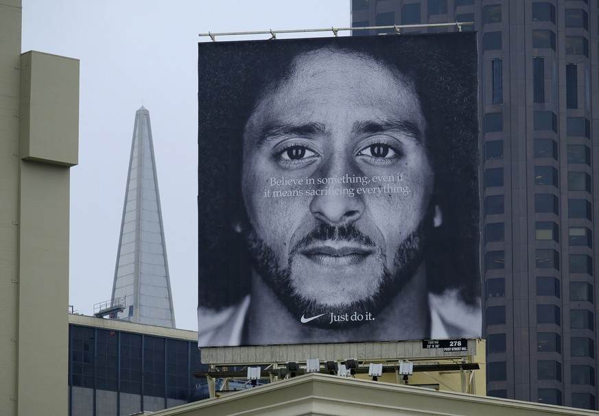 FILE - In this Sept. 5, 2018, file photo, a large billboard stands on top of a Nike store showing former San Francisco 49ers quarterback Colin Kaepernick, at Union Square in San Francisco. Nike is pul ...