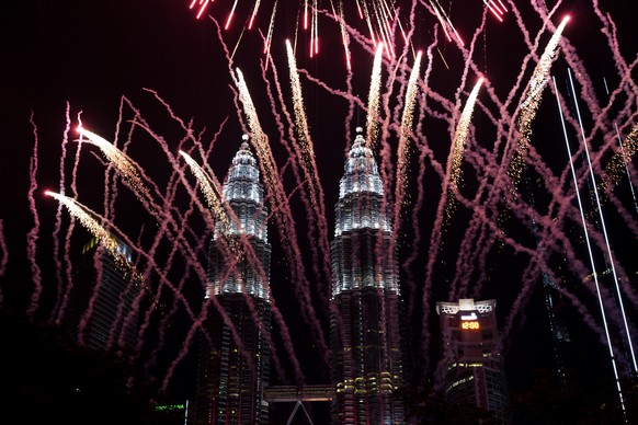 Fireworks explode in front of Malaysia&#039;s landmark building, the Petronas Twin Towers, during the New Year&#039;s celebration in Kuala Lumpur, Malaysia, Tuesday, Jan. 1, 2019.(AP Photo/Yam G-Jun)