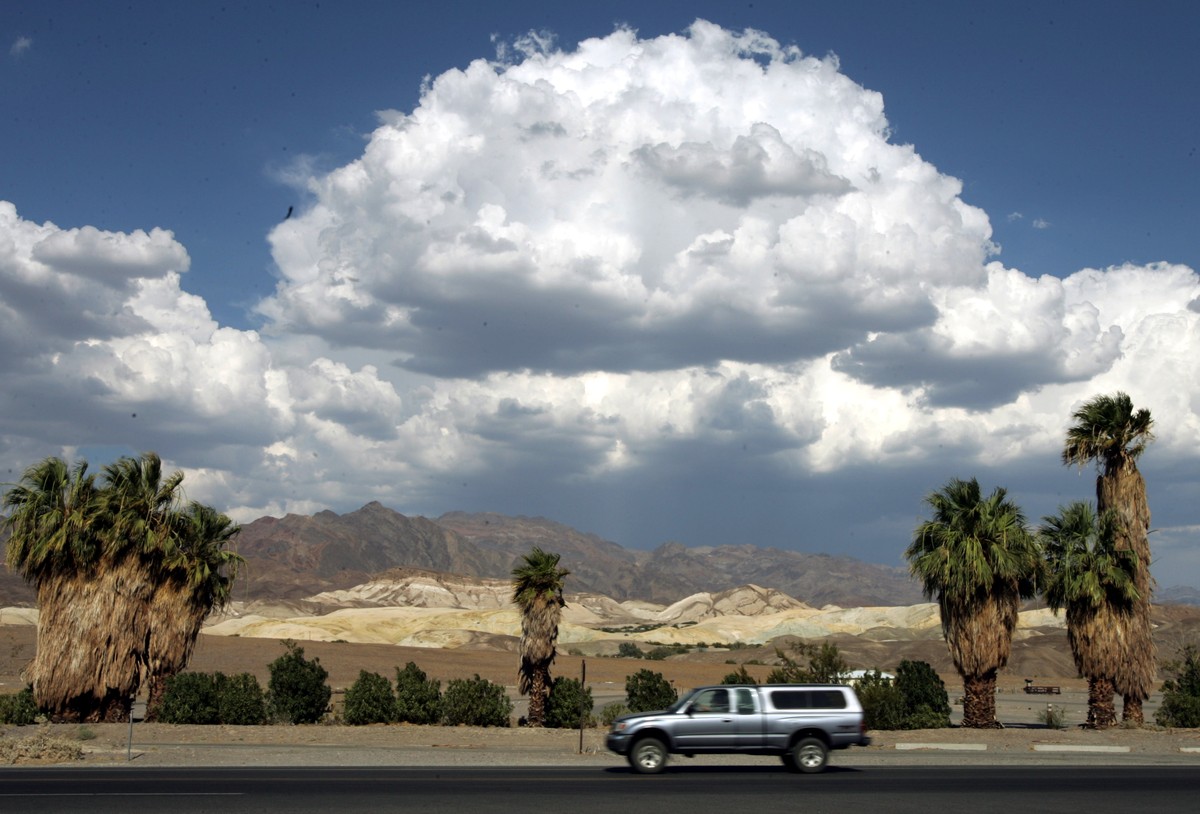 FILE - This July 22, 2005 file photo shows clouds over the Amargosa Range at Furnace Creek in Death Valley National Park in California's Mojave Desert. Located about two hours west of Las Vegas a ...