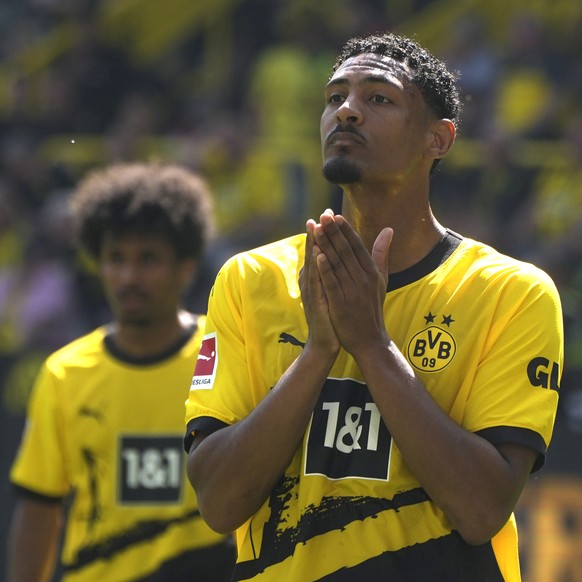 Dortmund's Sebastien Haller reacts after failing to score a penalty kick during the German Bundesliga soccer match between Borussia Dortmund and FSV Mainz 05 in Dortmund, Germany, Saturday, May 2 ...