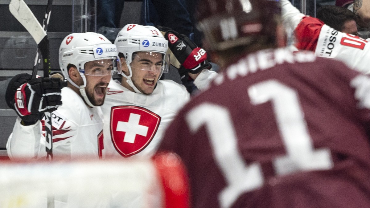 Switzerland's Nico Hischier, middle, and the team celebrate after scoring the 2:1 during the game between Latvia and Switzerland, at the IIHF 2019 World Ice Hockey Championships, at the Ondrej Ne ...