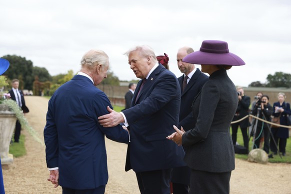 President Donald Trump and first lady Melania Trump are welcomed by Britain&#039;s King Charles III, in the Walled Garden on the Windsor Castle estate, in Windsor, England, Wednesday, Sept. 17, 2025.  ...