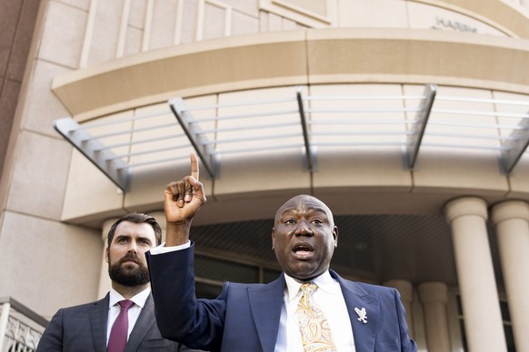 Attorney Benjamin Crump, right, speaks with attorney Alex Hilliard during a press conference announcing lawsuits on behalf of about 200 attendees from last week&#039;s Astroworld Festival at the Harri ...
