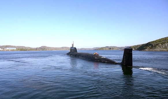 epa12370957 A still image taken from a handout video provided by the Russian Defence Ministry press service on 12 September 2025 shows a submarine of Russian Navy&#039;s Northern Fleet taking part in  ...