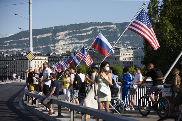 Flags of the US and Russia wave on the Mont Blanc bridge in Geneva, Switzerland, Tuesday, June 15, 2021 the day before the US - Russia summit . The meeting between US President Joe Biden and Russian P ...