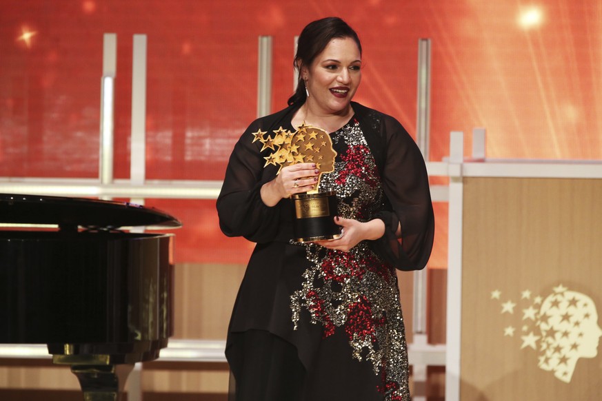 British school teacher Andria Zafirakou reacts after winning the Global Teacher Prize at a ceremony in Dubai, United Arab Emirates, Sunday, March 18, 2018. Zafirakou won the $1 million prize for teach ...
