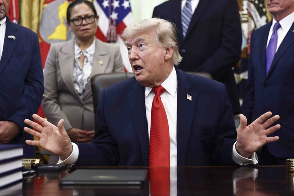 epa13031440 US President Donald Trump responds to a question from the news media after signing a fisheries proclamation in the Oval Office of the White House in Washington, DC, USA, 11 June 2026. Trum ...