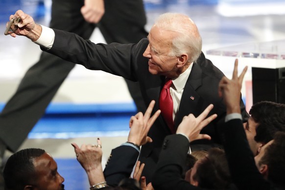 Democratic presidential candidate former Vice President Joe Biden greets spectators and takes a photo after a Democratic presidential primary debate, Wednesday, Nov. 20, 2019, in Atlanta. (AP Photo/Jo ...