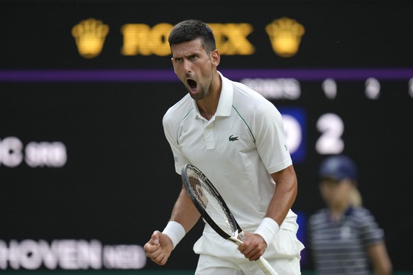 Serbia&#039;s Novak Djokovic celebrates winning a point against Tim van Rijthoven of the Netherlands during a men&#039;s fourth round singles match on day seven of the Wimbledon tennis championships i ...