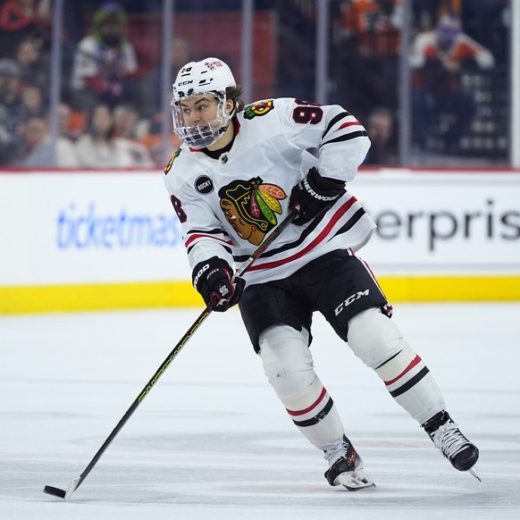 Chicago Blackhawks&#039; Connor Bedard skates with the puck during the first period of an NHL hockey game against the Philadelphia Flyers, Saturday, March 30, 2024, in Philadelphia. (AP Photo/Matt Slo ...
