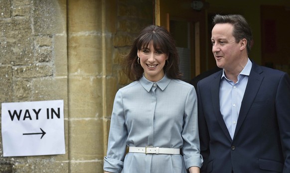 Britain&#039;s Prime Minister David Cameron and his wife Samantha leave after voting in Spelsbury, central England, Britain May 7, 2015. British voters get to decide on Thursday who they want to rule  ...