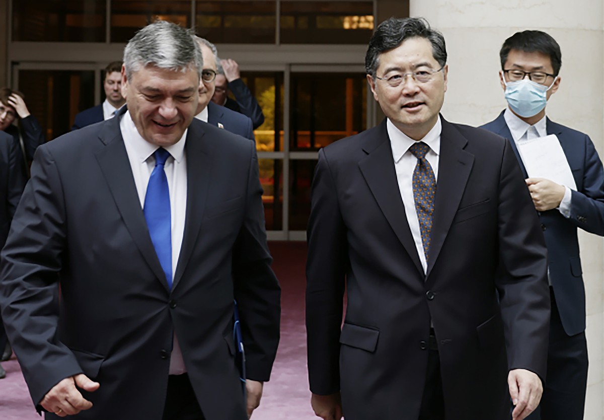 FILE - In this file photo released by Ministry of Foreign Affairs of the People's Republic of China, China's Foreign Minister Qin Gang, front right, walks next to Russian Deputy Foreign Mini ...