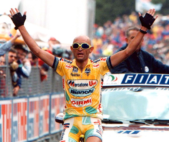 Italy&#039;s Marco Pantani reacts as he crosses the finish line to win the 165Km Schio to Piancavallo 14th stage of the Tour of Italy Saturday, May 30,1998. (AP Photo/Alessandro Trovati)