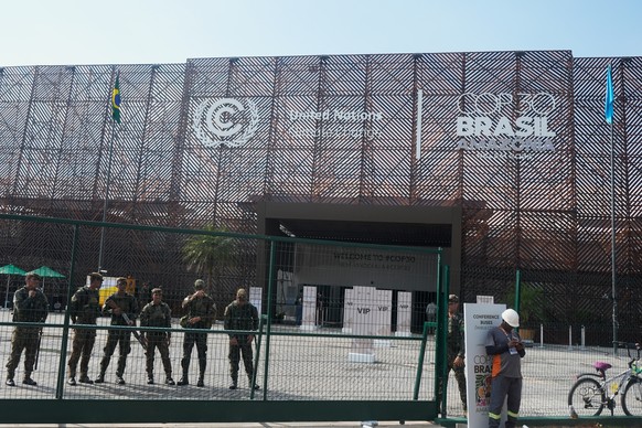 Security personnel stand outside the venue for the COP30 U.N. Climate Summit after it a fire was reported on Thursday, Nov. 20, 2025, in Belem, Brazil. (AP Photo/Fernando Llano)
Climate COP30