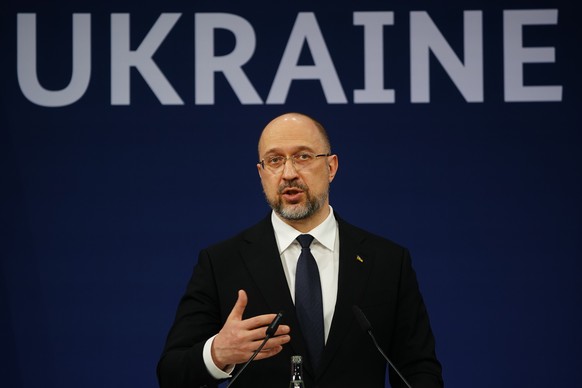 epa10264414 Ukrainian prime minister Denys Schmyhal speaks next to German Chancellor Olaf Scholz and European Commission President Ursula von der Leyen (both not in the picture) during a joint press c ...