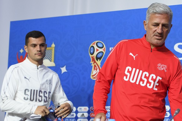 Switzerland&#039;s head coach Vladimir Petkovic, right, and Switzerland&#039;s midfielder Granit Xhaka, left, arrive for a press conference on the eve of the FIFA World Cup 2018 round of 16 soccer mat ...