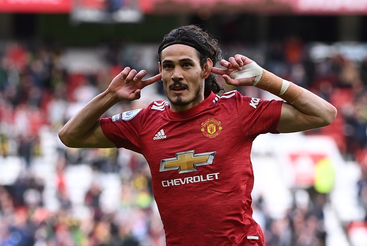 epa09209347 Manchester United���s Edison Cavani reacts after scoring during the English Premier League soccer match between Manchester United and Fulham FC in Manchester, Britain, 18 May 2021. EPA/Lau ...