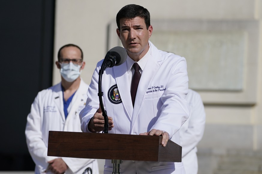 Dr. Sean Conley, physician to President Donald Trump, talks with reporters at Walter Reed National Military Medical Center, Monday, Oct. 5, 2020, in Bethesda, Md. (AP Photo/Evan Vucci)
Sean Conley