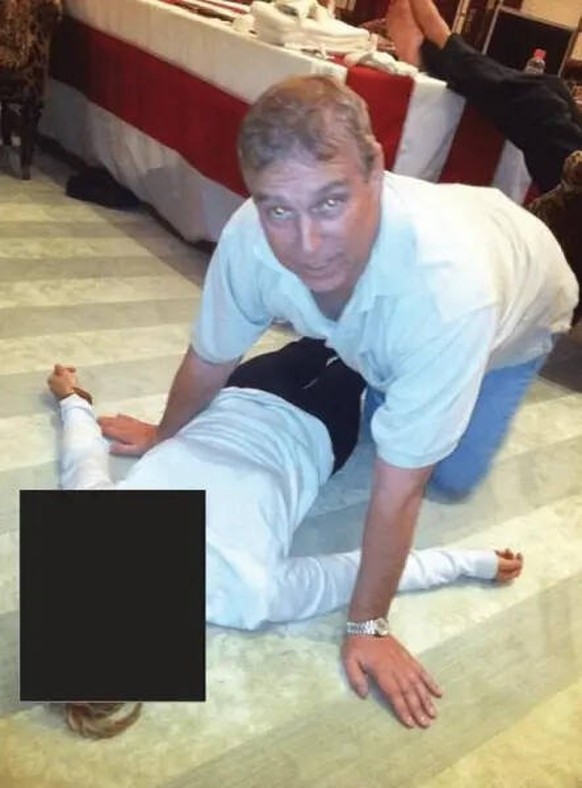 Story from Jam Press Epstein Files Pictured: Andrew Mountbatten-Windsor crouched on all fours over an unidentified woman lying on the floor, in images released as part of the Jeffrey Epstein files. PH ...