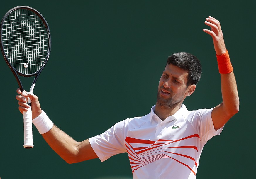 epa07515775 Novak Djokovic of Serbia reacts during his quarterfinal match against Daniil Medvedev of Russia at the Monte-Carlo Rolex Masters tournament in Roquebrune Cap Martin, France, 19 April 2018. ...