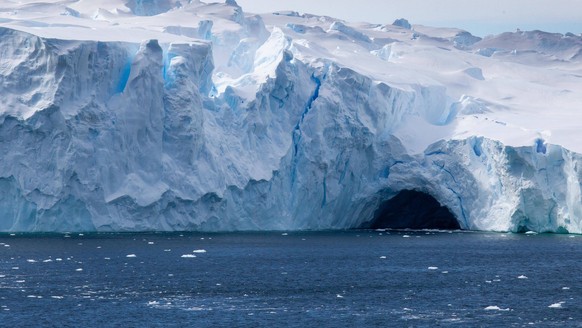 epa09699744 A handout photo made available by the Australian Antarctic Division (AAD) shows the Vanderford Glacier, Antarctica, 18 January 2022 (issued 21 January 2022). A deep canyon at the front of  ...