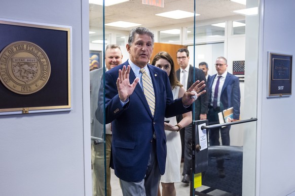 epa09293513 Democratic Senators from West Virginia Joe Manchin leaves the Office of Democratic Senator from Arizona Kyrsten Sinema (not pictured) after a meeting between the group of 10 Senators attem ...