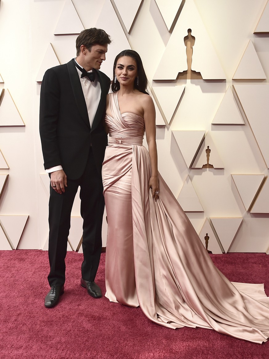 Ashton Kutcher, left, and Mila Kunis arrive at the Oscars on Sunday, March 27, 2022, at the Dolby Theatre in Los Angeles. (Photo by Jordan Strauss/Invision/AP)
Ashton Kutcher,Mila Kunis