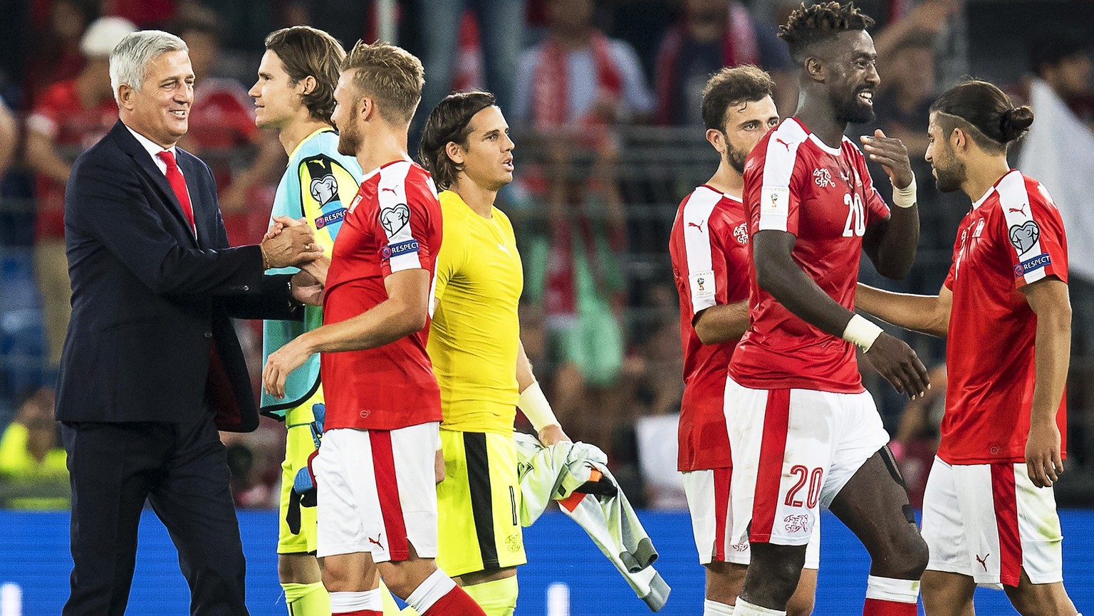 epa05527773 Swiss head coach Vladimir Petkovic (L) celebrates with his players after the FIFA World Cup 2018 group B qualifying soccer match between Switzerland and Portugal at the St. Jakob-Park stad ...