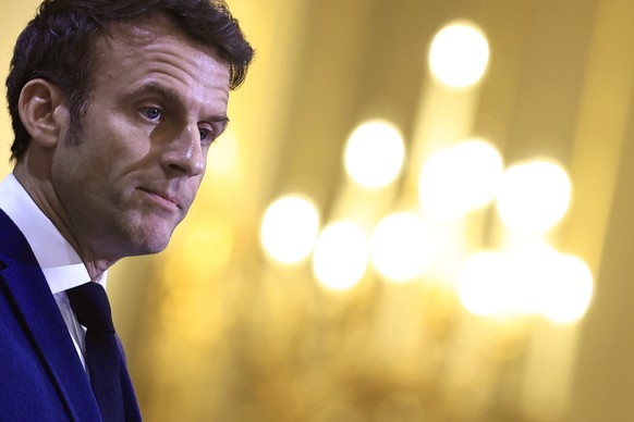 epa10434624 French President Emmanuel Macron delivers a speech as he holds a ceremony with members of the French Asian community to mark the Lunar New Year at the Elysee Palace in Paris, France, January 27...